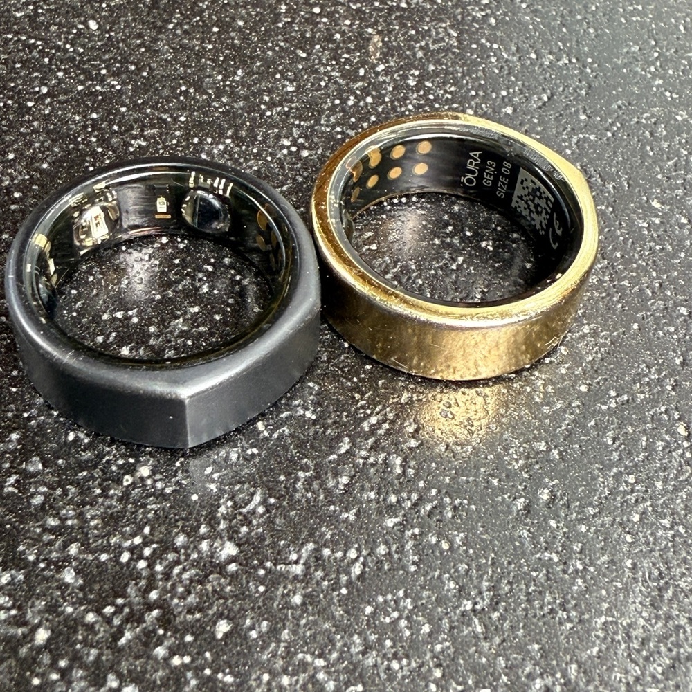 Oura Rings in Sleek Black and Elegant Gold